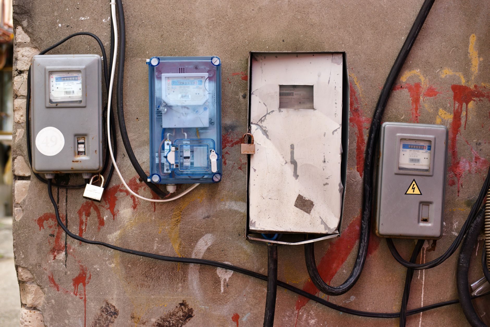 solar panels on a suburban home roof with a utility meter on the wall